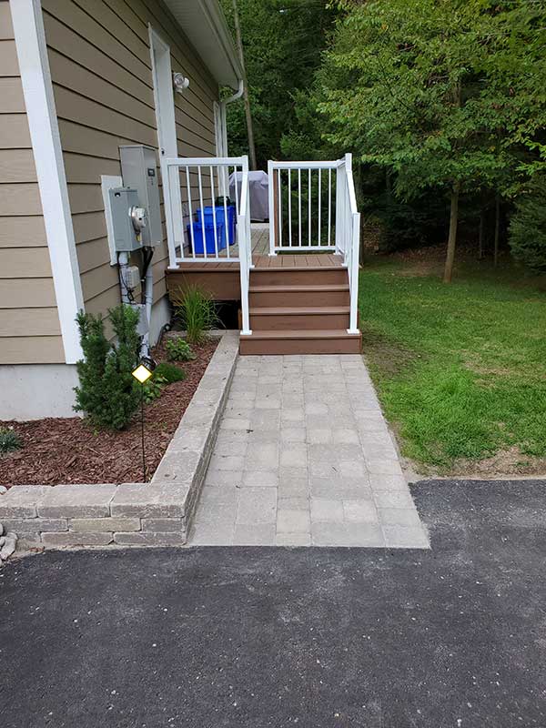 side unilock walkway to deck